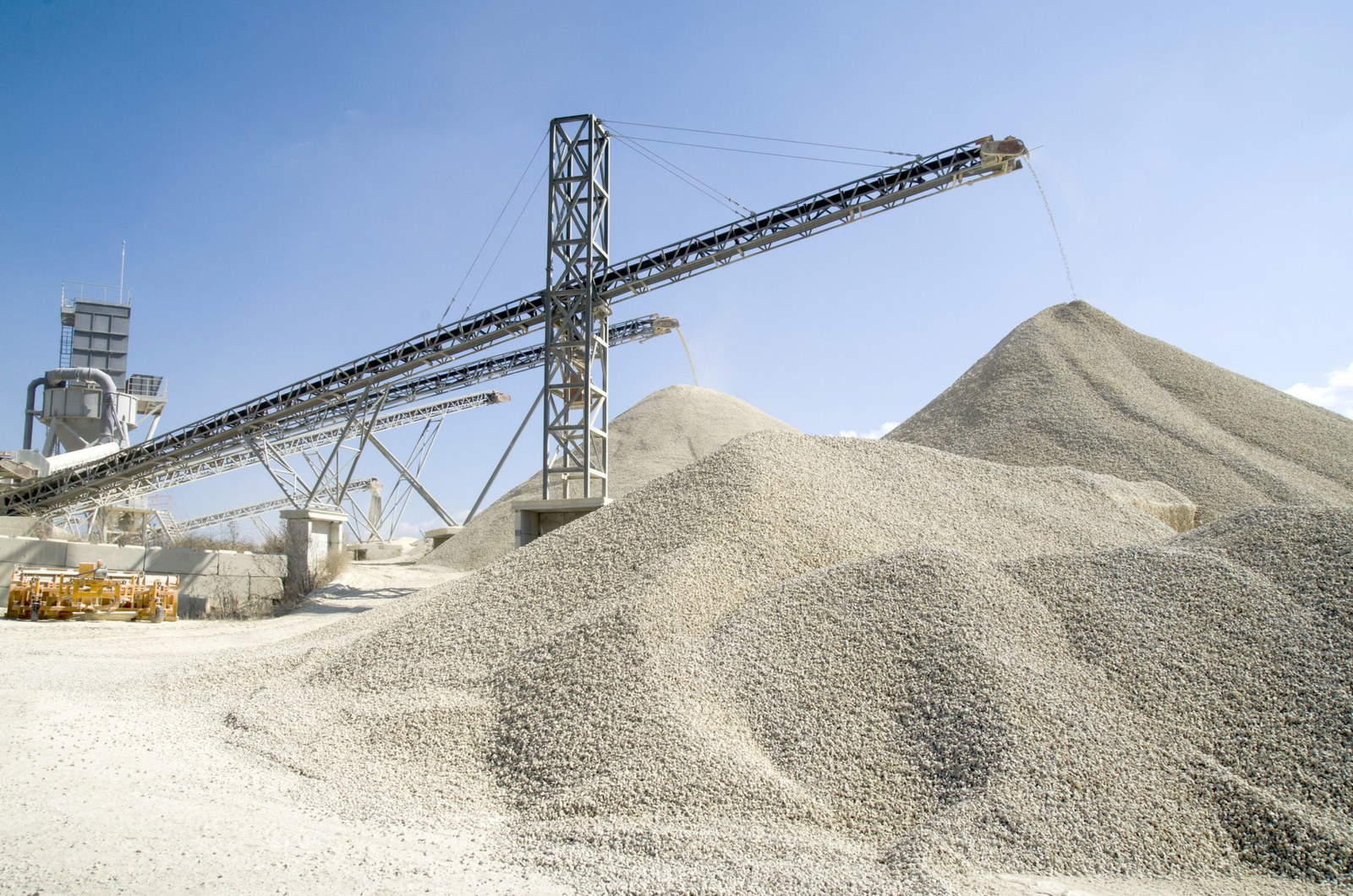 Working belt conveyors and a piles of rubble in Gravel Quarry